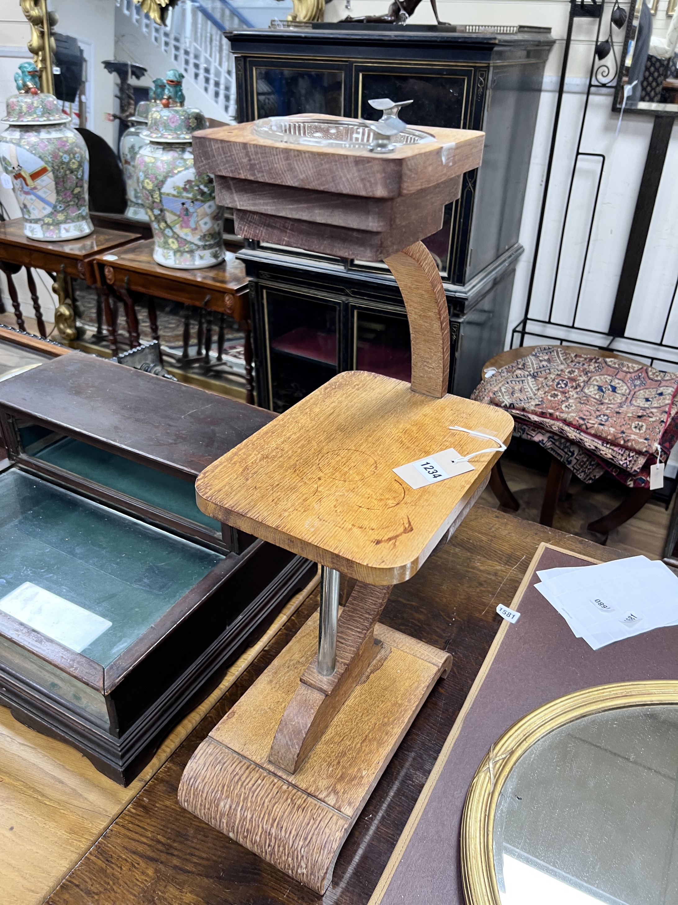 An Art Deco oak smoker's stand, height 65cm